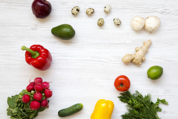 Frame of raw food on white wooden background. Healthy food concept. Flat lay. Top view. From above.