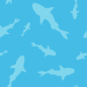 Vector seamless pattern of shark fish silhouette on blue background