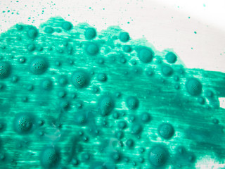 green paint on white Board