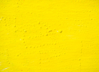 yellow paint on white Board