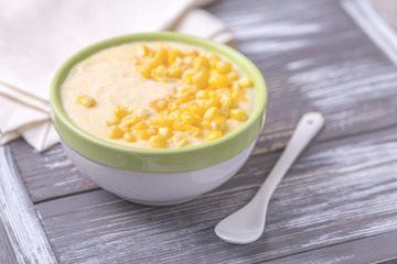 Polenta with feta. Corn porridge. Italian appetizers. Wooden background.