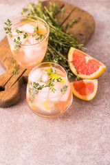 Gin bitter lemon with thyme and grapefruit. Fruit lemonade.