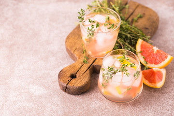 Gin bitter lemon with thyme and grapefruit. Fruit lemonade.