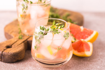 Gin bitter lemon with thyme and grapefruit. Fruit lemonade.