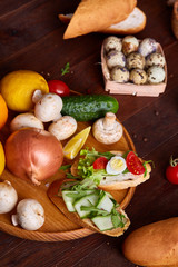 Breakfast still life with sandwiches, quail eggs, spicies and fresh fruits and vegetables, selective focus