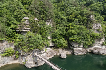 Fototapeta premium To-no-Hetsuri , A spectacular sight of a carved rock face millions of years in the making. To no Hetsuri is a popular sightseeing spot in Fukushima Prefecture.