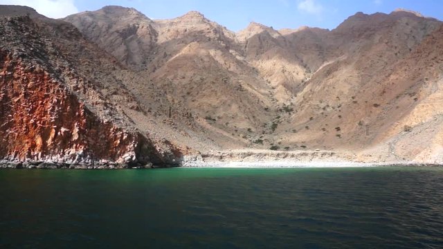 Ship travel sails along Musandam peninsula, Sultanate of Oman, Gulf of Oman