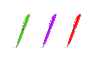 Colored plastic ballpoint pens on a white background.