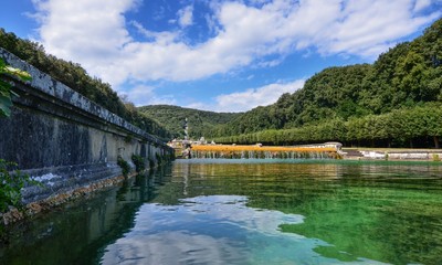 Fototapeta premium Caserta, Campania region, Italy August 22 2016. The splendid Royal Palace of Caserta, with its three kilometers of promenade along the fountains and pools adorned with statues.