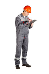 Male builder over white wall background. repair, construction, building, people and maintenance concept.