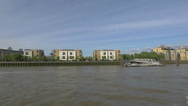 Pier and buildings on the riverside, London