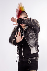 Portrait of punk rocker with Mohawk hairstyle on a white background.