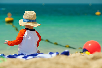 Two year old toddler boy beach