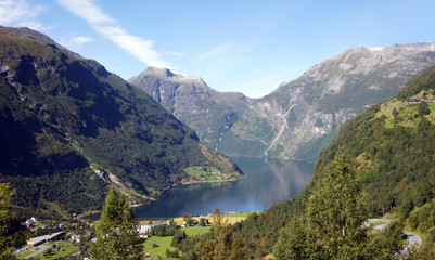 Scenic top view of the Geiranger fjord, beautiful norwegian nature, sunny day with blue sky, Norway