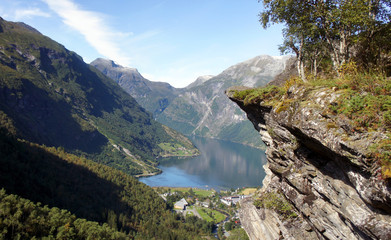 Naklejka na ściany i meble Scenic view of the Geiranger fjord, beautiful norwegian nature, sunny day, blue sky, Norway