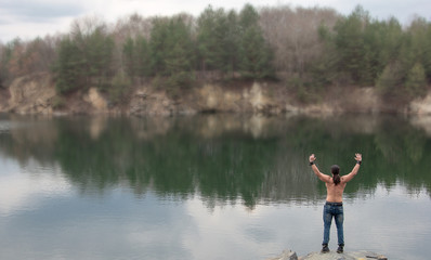 Fototapeta na wymiar relax union with nature man nature training fitness body lake reflection