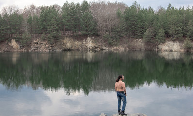 Fototapeta na wymiar man training fitness nature lake reflection relaxation unity with nature