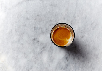 Glass of Espresso Coffee on gray marble background