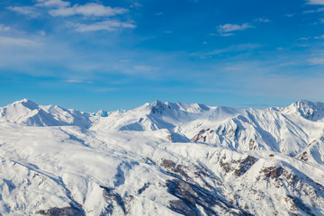 Fototapeta na wymiar Picturesque view snowy mountain peaks panorama, Les Menuires ,Alps, France, ski slopes in 3 Valleys
