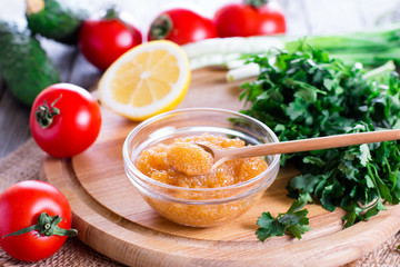 Salty yellow caviar of pike fish with spoon