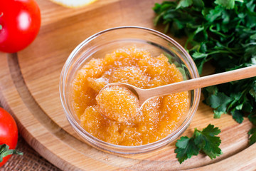 Pike caviar in a glass jar on the table