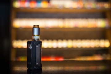 vape for smoking stands on a wooden table. Without nicotine.