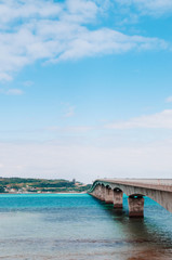 Fototapeta na wymiar Kouri bridge cross over blue sea to Kouri island, Naha, Okinawa, Japan