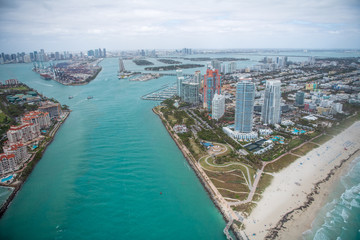 Fototapeta na wymiar South Pointe Park, Fisher Island and Miami skyline, aerial view from helicopter