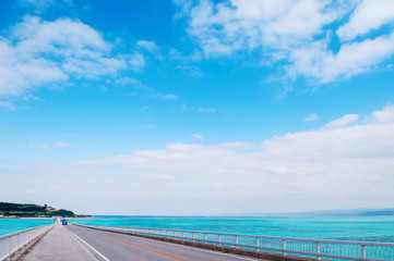 Fototapeta na wymiar Kouri bridge cross over blue sea to Kouri island, Naha, Okinawa, Japan