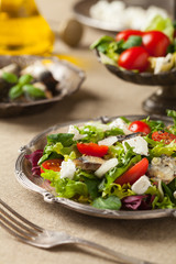 A delicious salad with sardines and feta cheese.