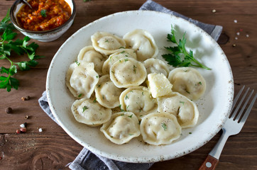 Dumplings with meat, spiced with pepper and dill