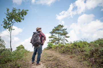 Young man Hiking in in the forest