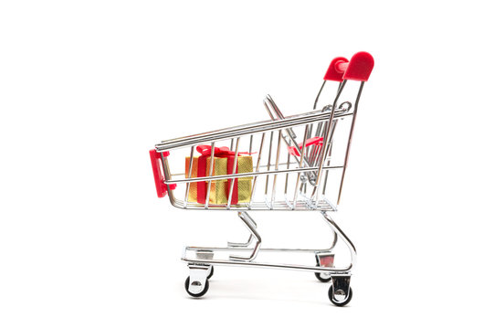 Gift box and shopping cart on white background : economy concept