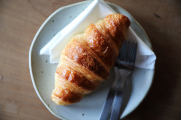 croissant on wood background