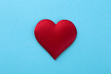 Decorative colourful sponge is small heart blue background