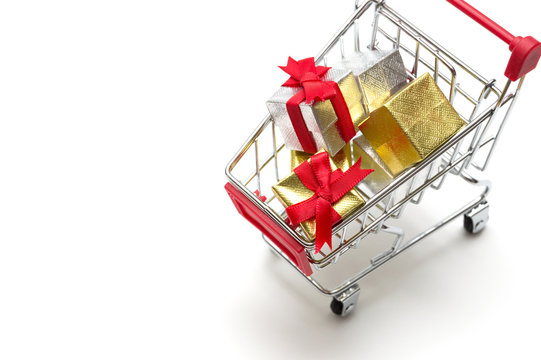 Gift box and shopping cart on white background : economy concept