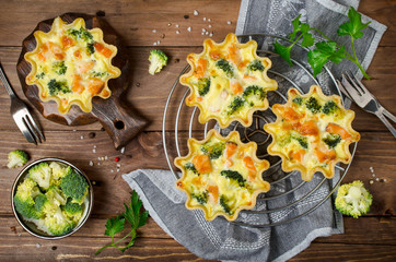 Tasty mini quiches with red fish salmon and broccoli