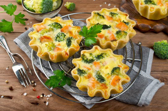 Tasty mini quiches with red fish salmon and broccoli