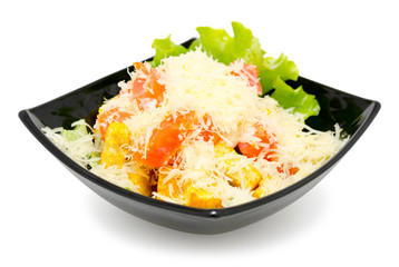 fresh caesar salad in black plate