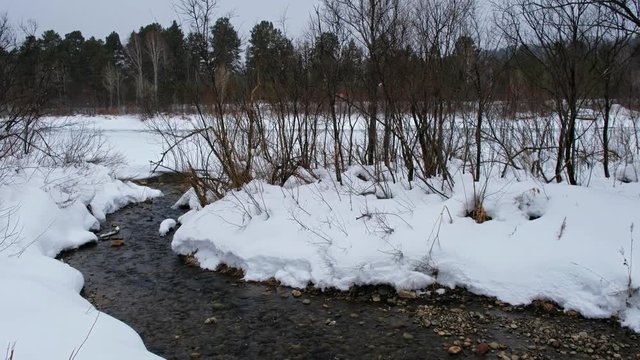 Small creek in altai village Ust'-Lebed' in winter season