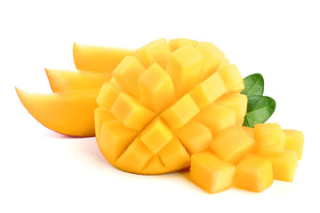 Mango fruit half with leaves and slices isolated on white background close-up