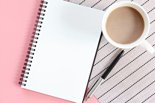 Still life, business, office supplies, planning or education concept : Top view or flat lay of open notebook with blank pages and coffee cup on office table with copy space ready for adding or mock up