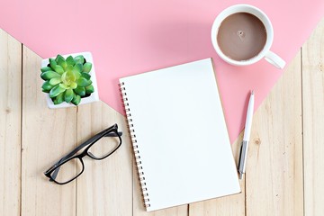 Still life, business, office supplies, planning or education concept : Top view or flat lay of open notebook with blank pages and coffee cup on office table with copy space ready for adding or mock up