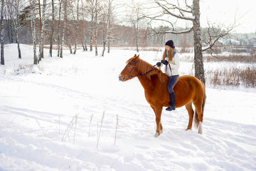 Fototapeta na wymiar Girl riding a horse