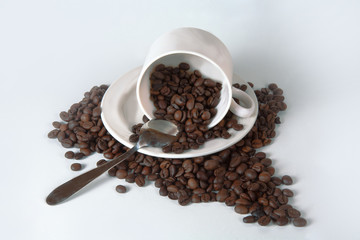 Coffee cup and beans on old kitchen table. Top view with copyspa