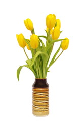 Yellow tulips in a vase isolated on white background. Spring flower, tulips bouquet.