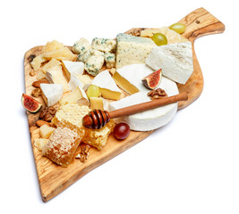 Camembert cheese with honey, figs, walnuts on wooden board