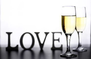glass of white wine on a table on white background isolate