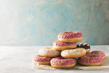 Stack of pink and white donats over blue background