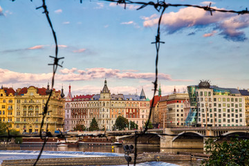 buildings of Prague behind wire mesh